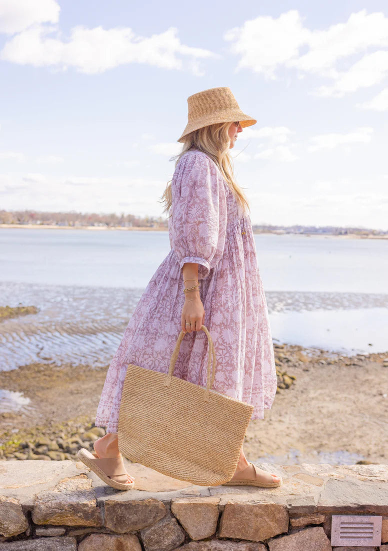 ALT text: A natural solid-coloured tote bag by Hat Attack, crafted from handwoven paper straw with durable shoulder straps.