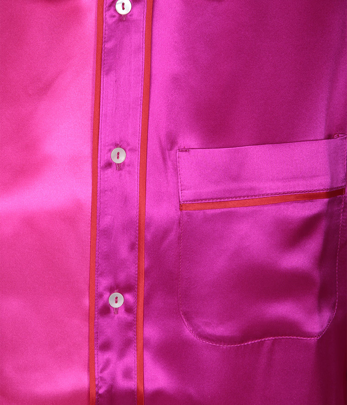 Close-up of the Adana Shirt's soft silk fabric, highlighting its smooth texture and vibrant fuchsia hue.