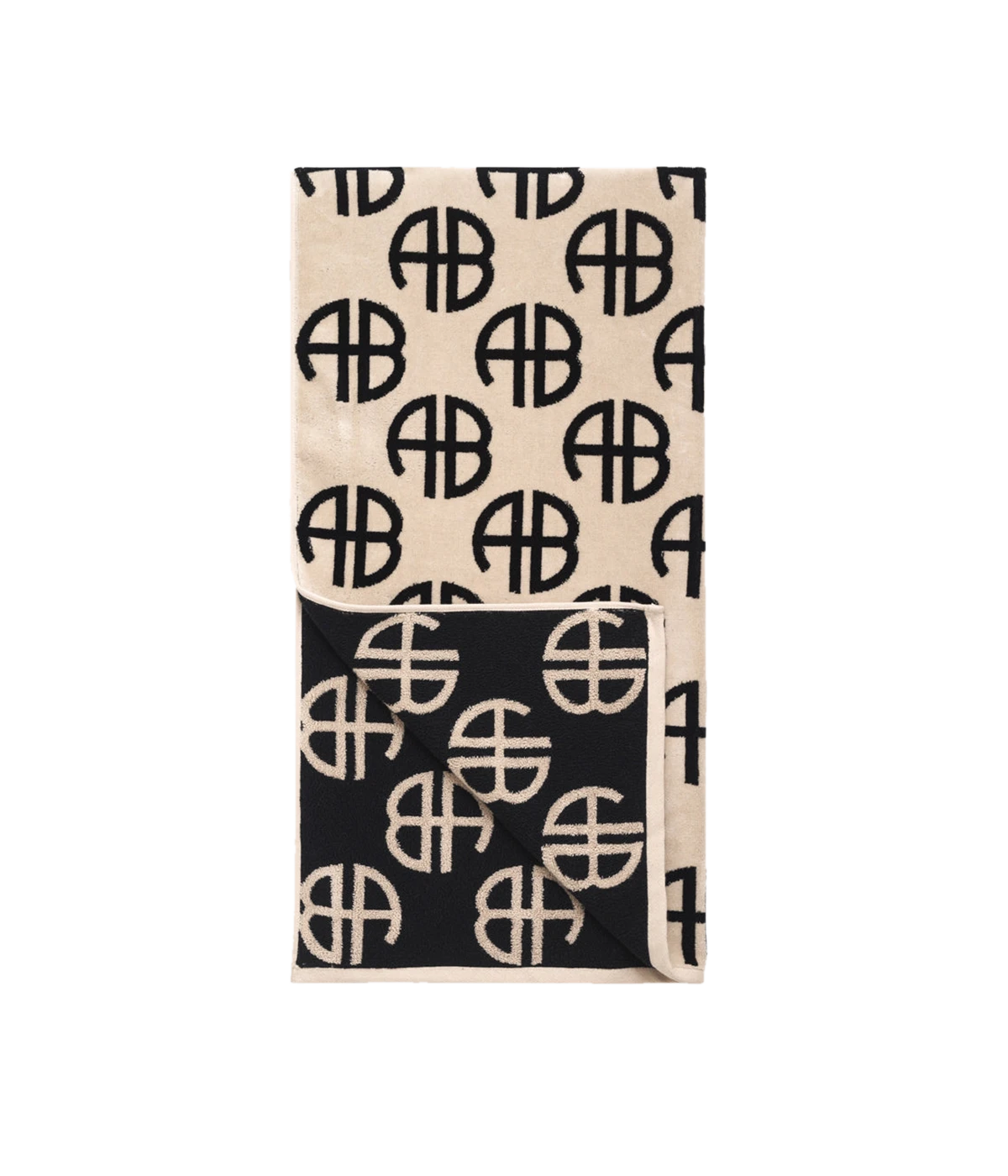 ALT text: ANINE BING Terry Towel in Beige featuring a large-scale monogram print on luxuriously soft terry-cloth fabric.