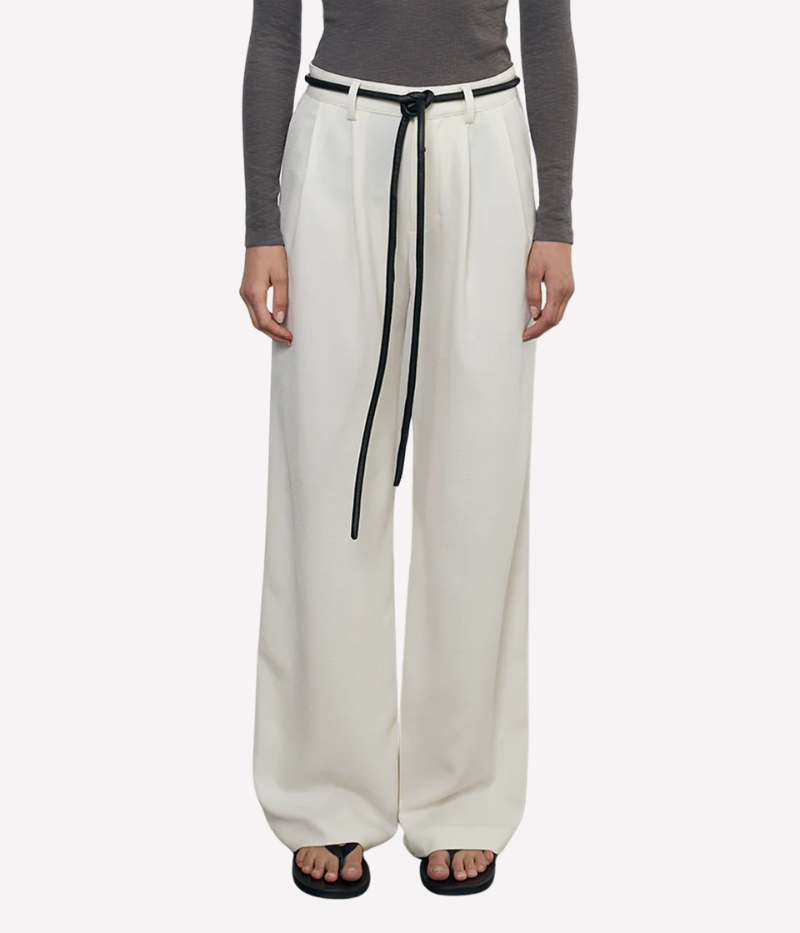 Mid-rise crepe trousers with a wide-leg silhouette, soft pleats, and functional pockets for a polished yet effortless look.