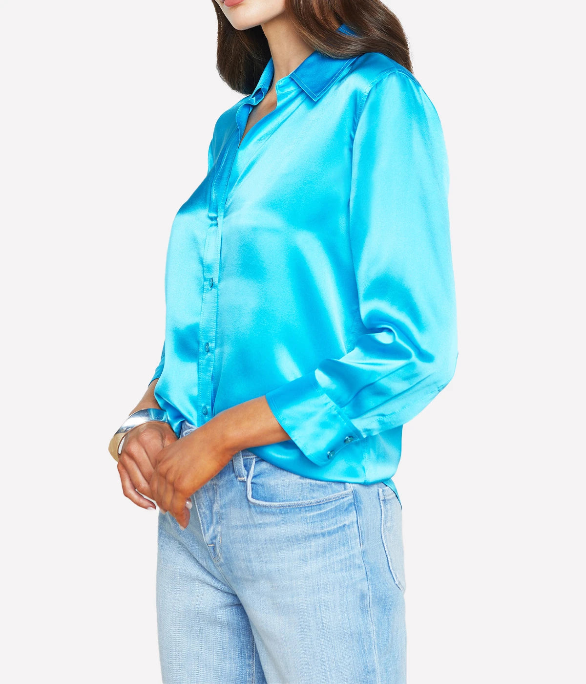 ALT Text: Dani Blouse in silk with a high-low hem, styled with jeans for a classic, polished look.