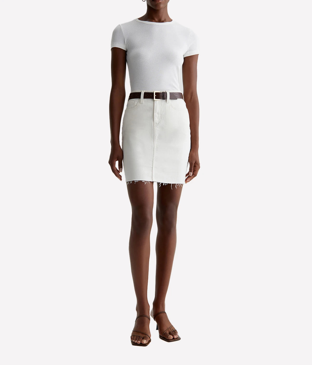 ALT Text: Erin Pencil Skirt in bright white denim with raw hem, figure-enhancing fit, and mid-thigh length.