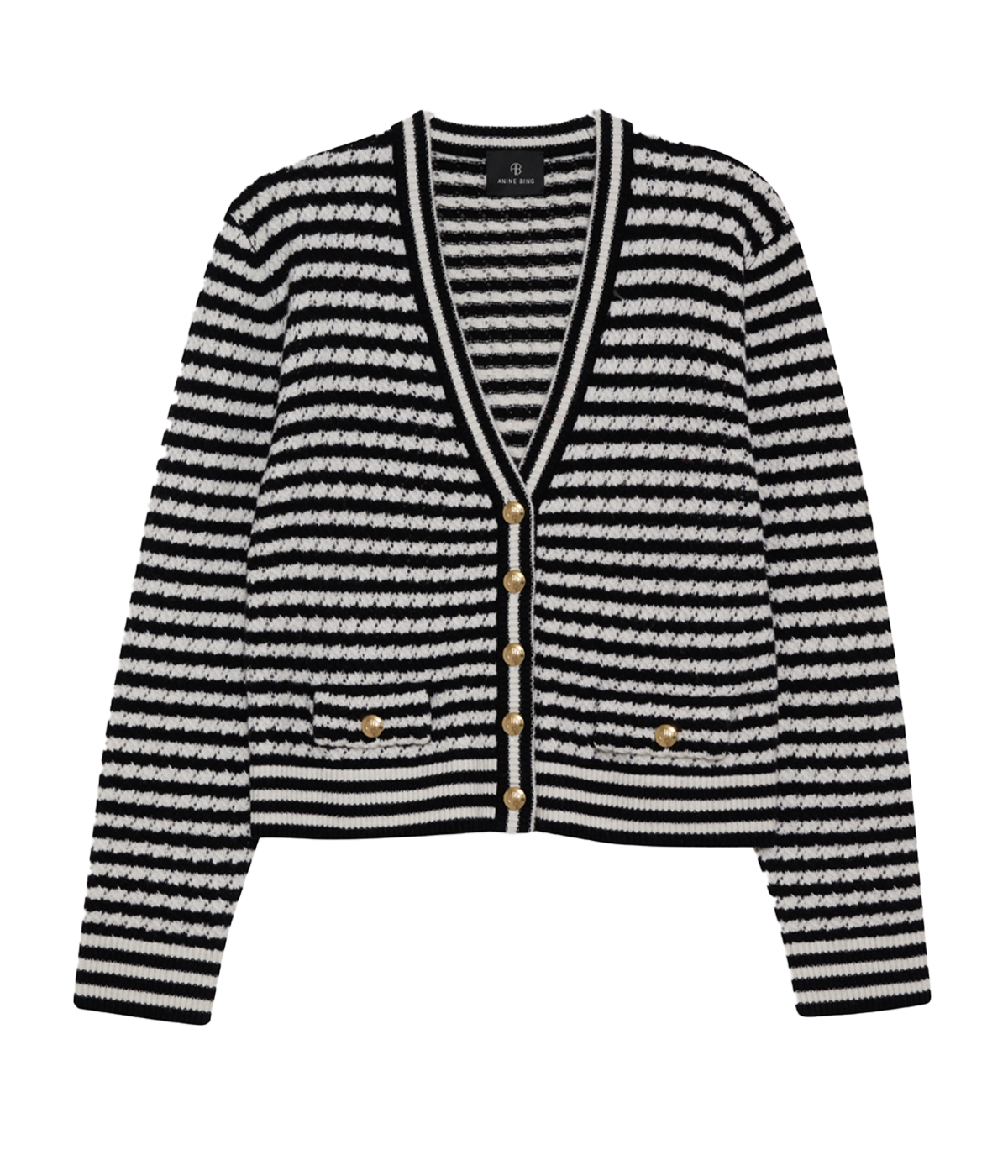 alt text: A black-and-white striped cardigan with a slightly oversized fit, crafted from a soft alpaca blend. Styled casually over a white tank and jeans, perfect for layering.