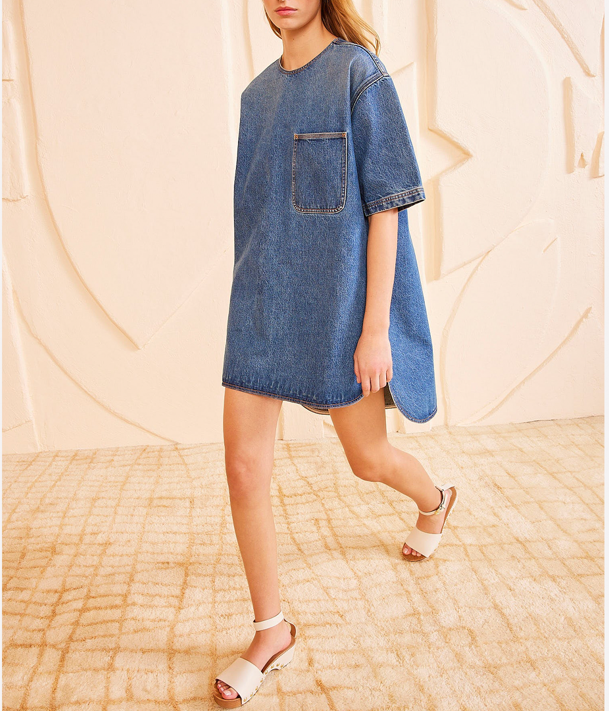 ALT text: Danube blue denim tunic with an oversized T-shirt silhouette and patch pocket detail.