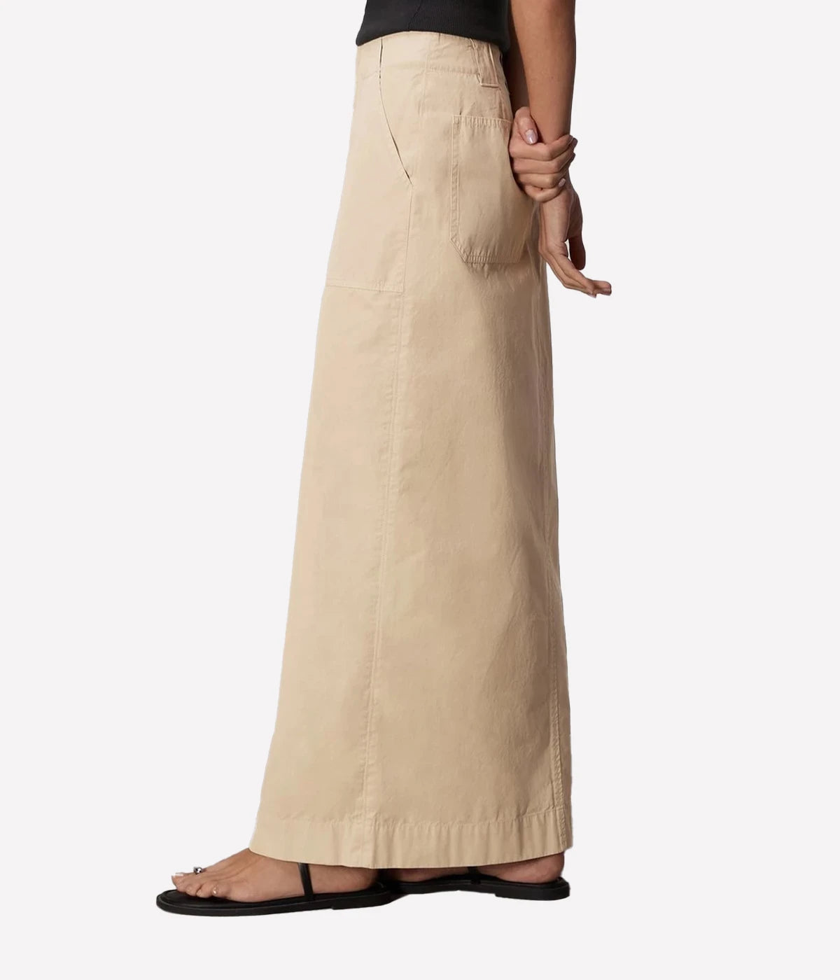 ALT Text for Product Image: Maxi skirt in lightweight Italian cotton with utilitarian details, including a zip closure and keeper button, styled for casual and polished looks.