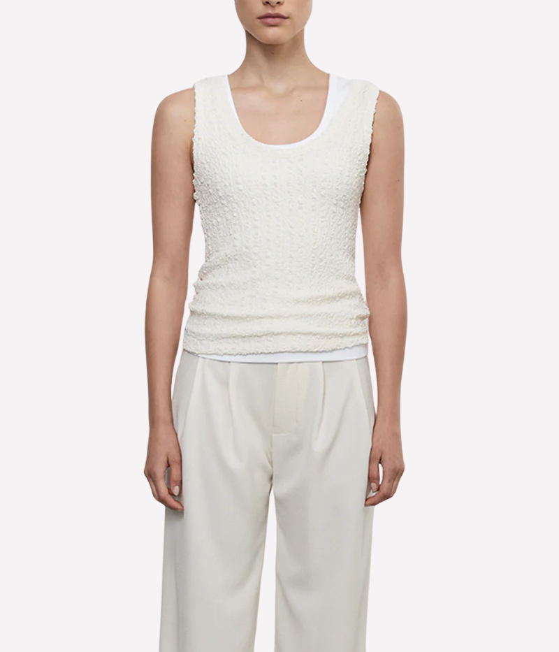 Lightweight tank with a delicately expandable texture and scoop neckline, styled for a relaxed and versatile look.