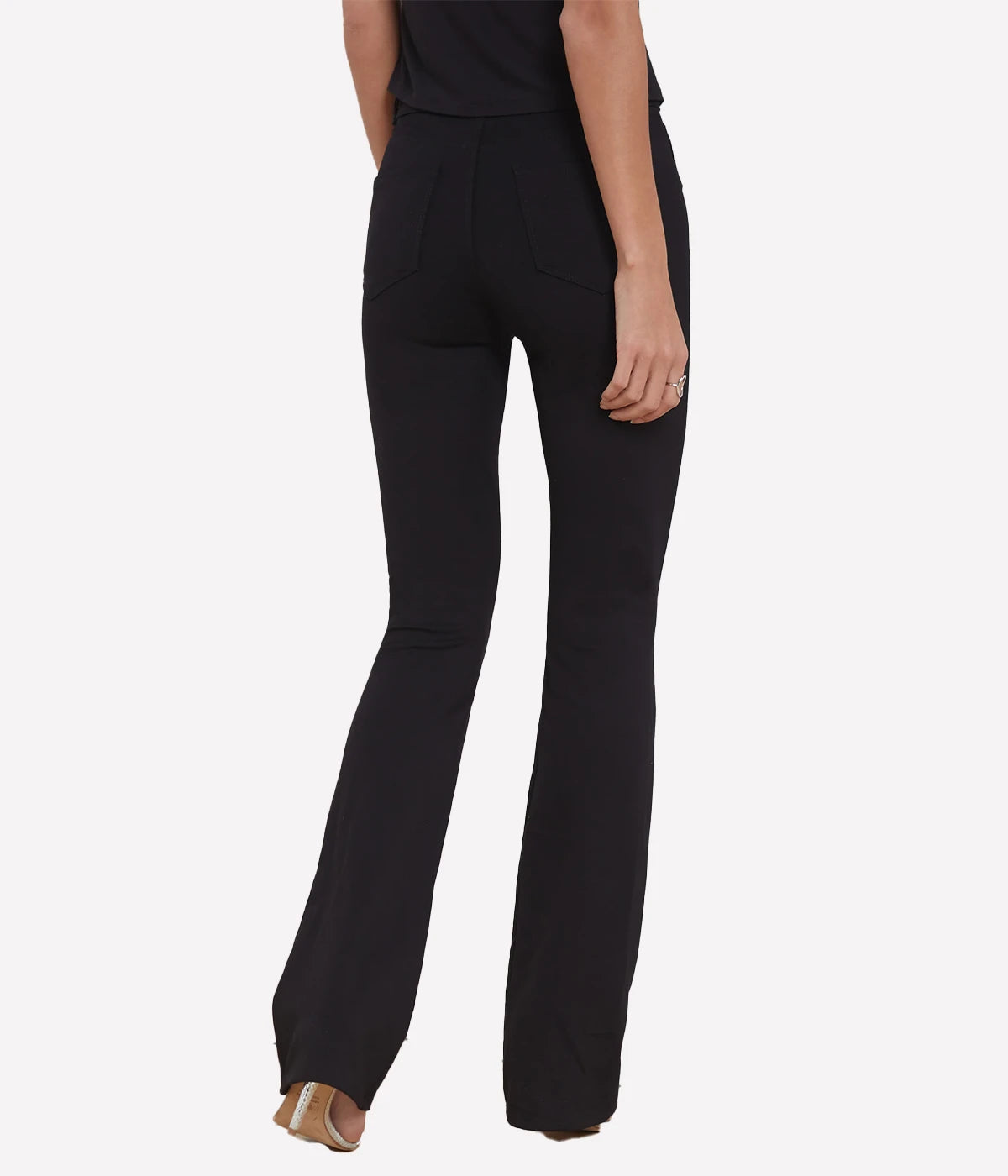 High-rise black bootcut pants with a sleek fit and tailored details, perfect for versatile styling.