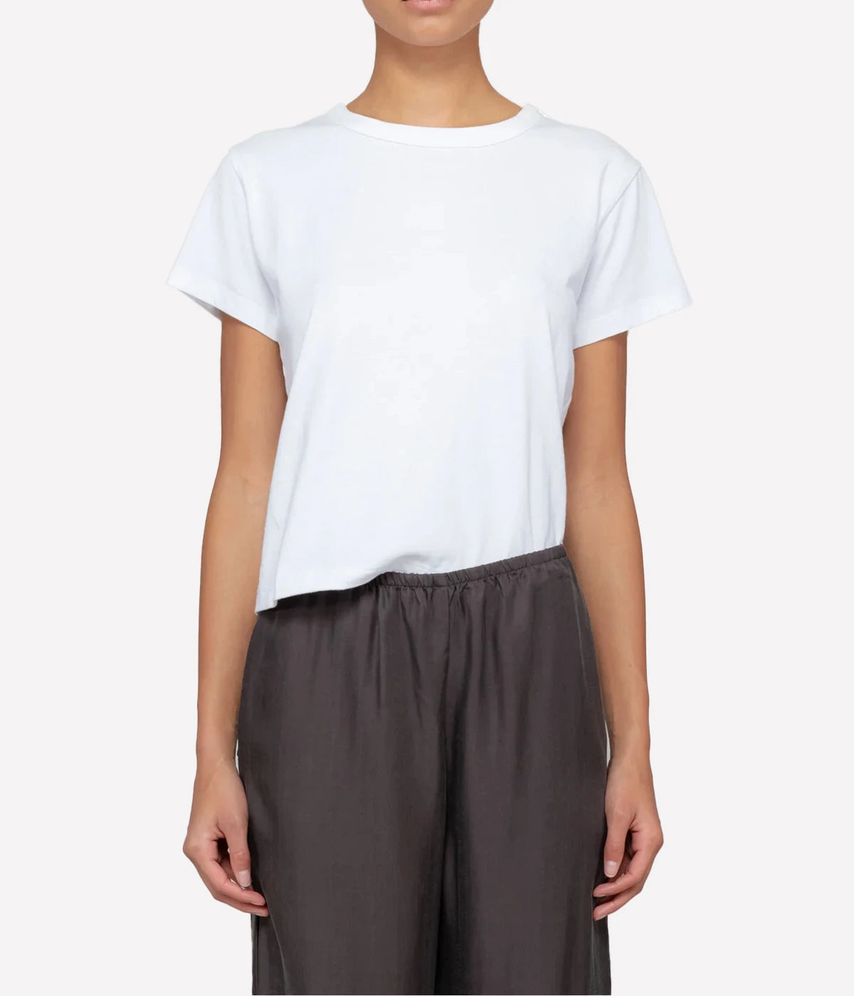 ALT TEXT: The Margo Tee in crisp white cotton, featuring a relaxed fit and classic crew neckline.