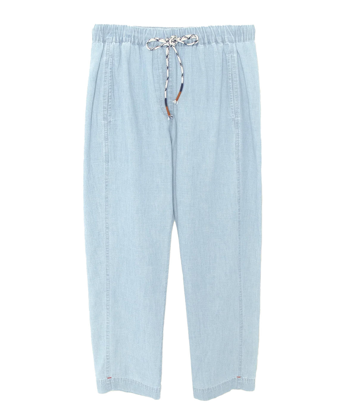 A pair of relaxed, slightly tapered pants in a soft dusty blue, made from cotton poplin fabric. The pants are styled with a tucked-in top, featuring a cropped inseam.