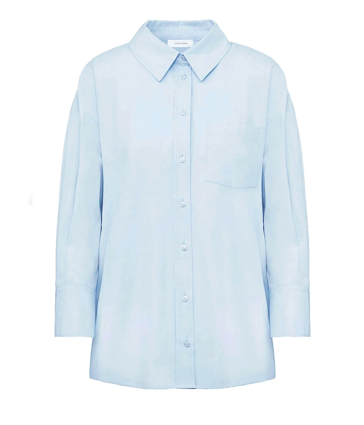 ALT Text: The Mika Shirt in blue with a tailored, oversized fit, featuring a crisp, structured look.